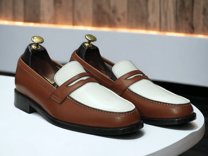 Experience comfort and style with Awesome Men's Handmade White &amp; Brown Loafer Shoes. Handcrafted with superior materials, these shoes are both elegant and durable. Perfect for any formal setting, these shoes will elevate your outfit and make you stand out. Don't sacrifice style for comfort, get the best of both worlds with these loafer shoes.