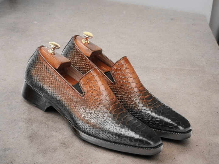 Discover the perfect blend of style and sophistication with our Awesome Designer Men's Handmade Brown Python Textured Leather Loafers. These men's dress shoes are crafted from high-quality leather, featuring a unique python texture for a luxurious touch. Perfect for formal parties and events, these loafers are sure to make a statement.